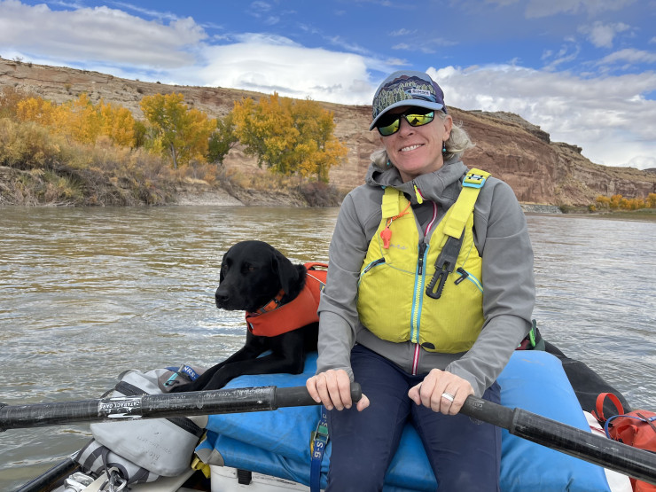 Belknap on the Colorado River with her dog, TR, in 2024