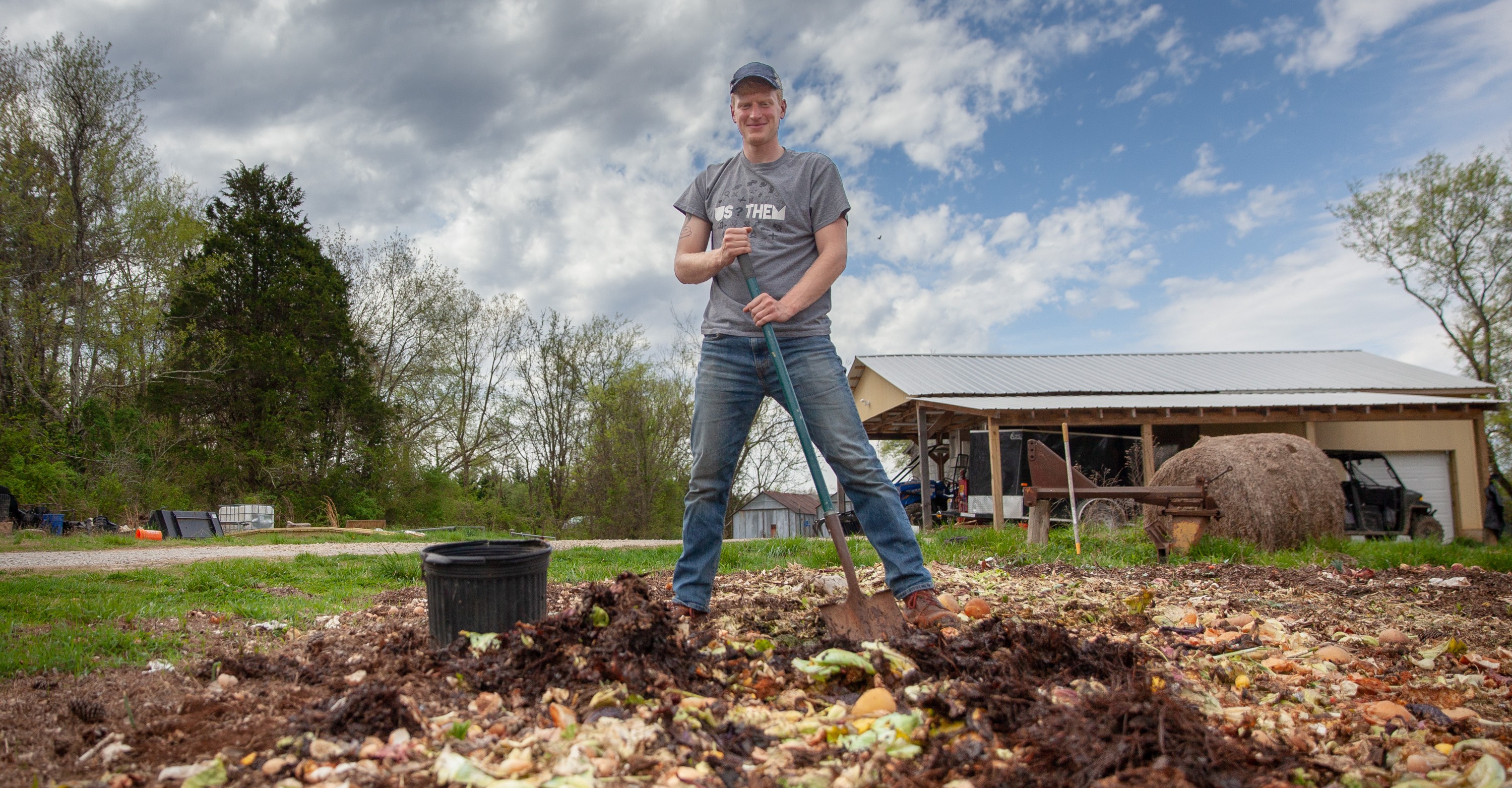  The King of Compost Mountain: Chris Hornsby atop a pile of food waste from Sewanee's McClurg Dining Hall. Photo by Buck Butler