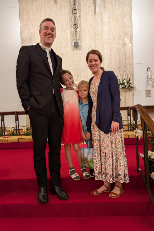 The Rev. Michael Christian Sturdy, T'25, and Lauren Hollon Sturdy with their children at Michael's ordination.