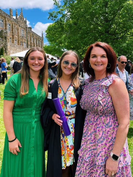 Anne Mitchell celebrating the Class of 2022's Commencement with her sister, Lillie Corinne, and mom, Shannon.