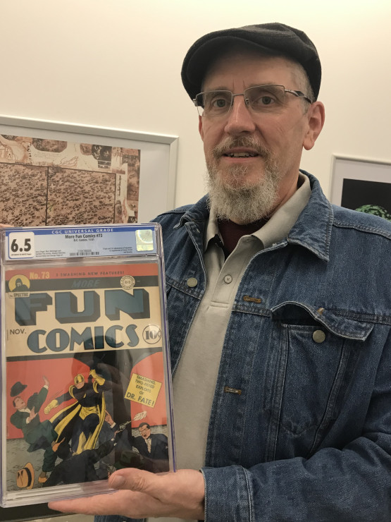 Lee with one of his record-setting comic books.