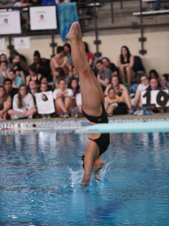 Simmons completing a reverse dive pike at the Southern Athletic Association (SAA) Championships early in her college career