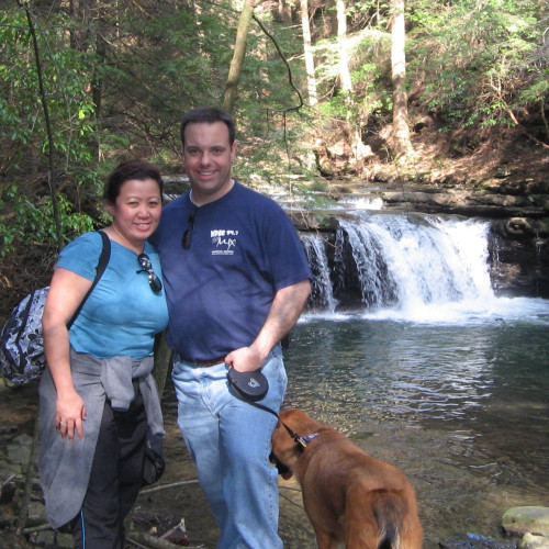 Val and Al hiking with their dog, Simba, on the Fiery Gizzard trail in 2009